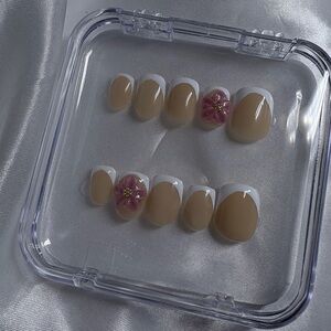 Elegant Nude and White Press-On Nails with Floral Accent